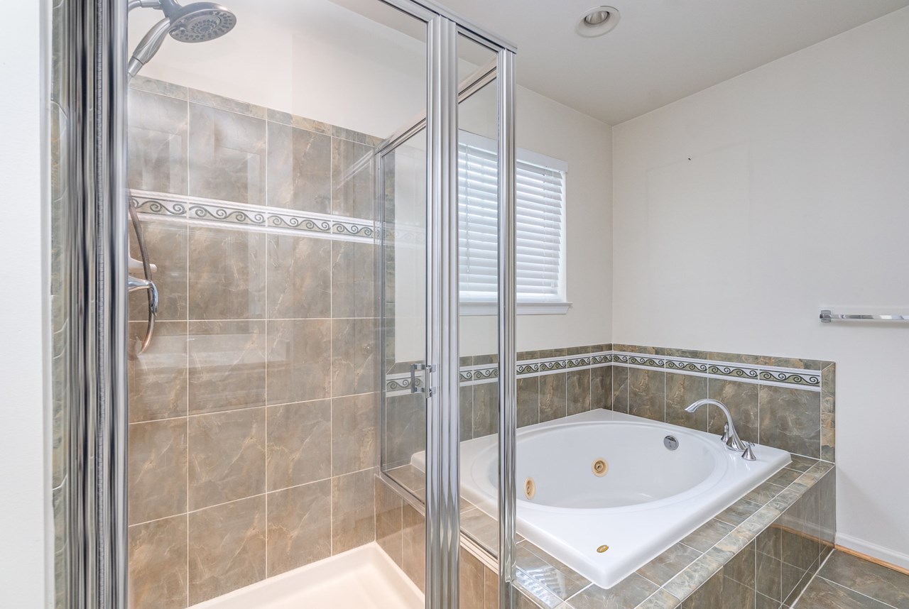 primary bathroom with soaking tub & shower