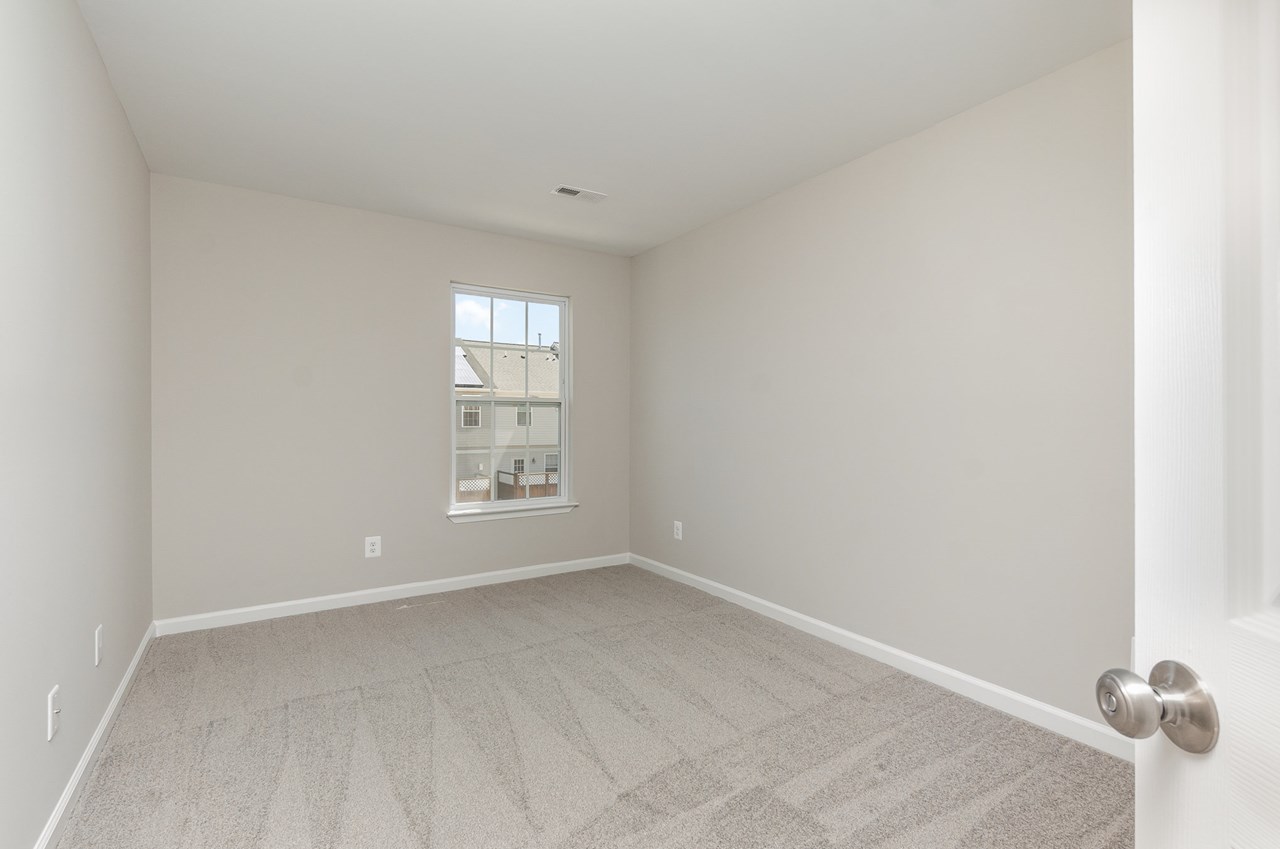 bedroom #3 with new carpet, window & paint