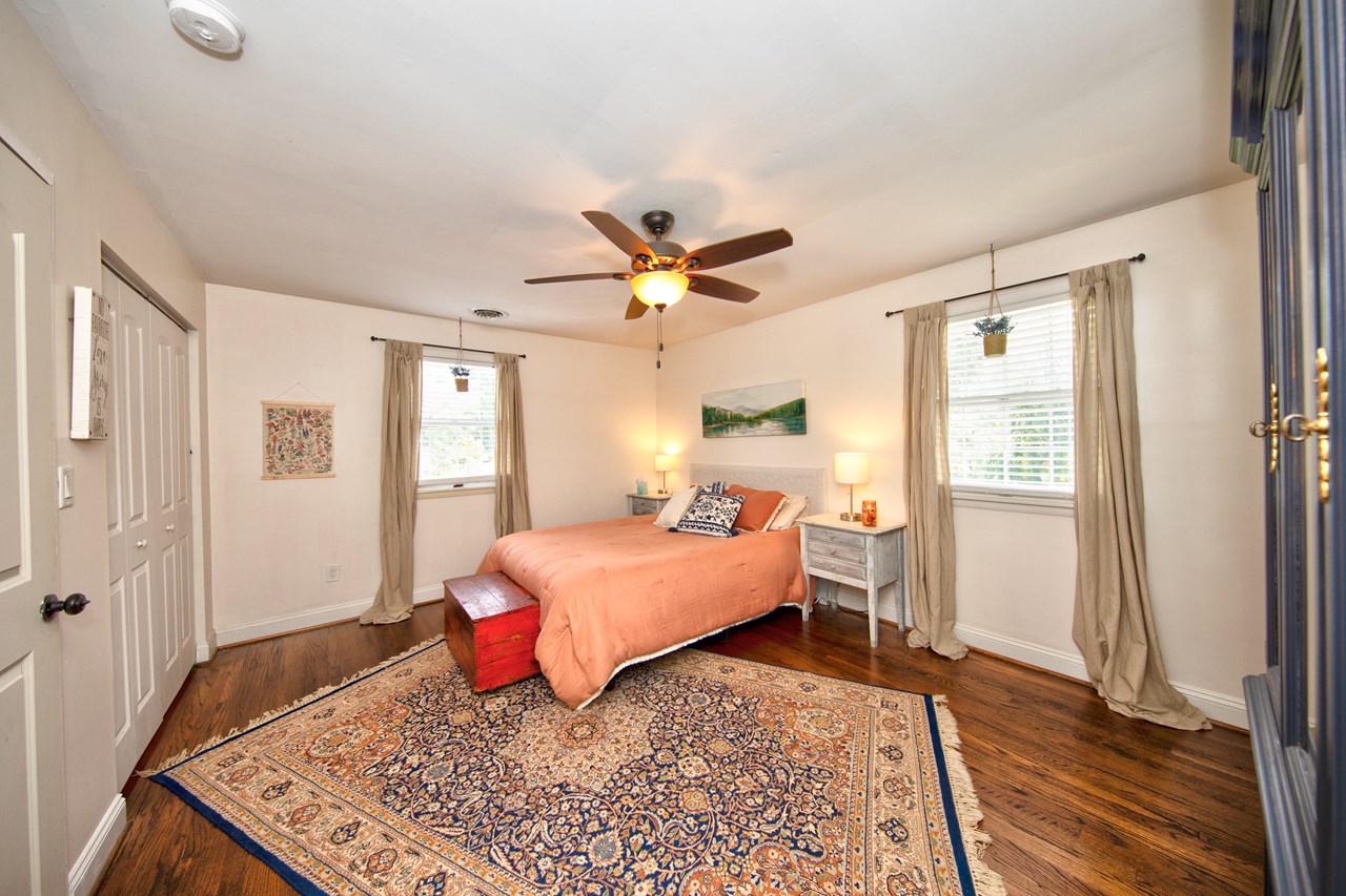 primary bedroom with hardwood floors