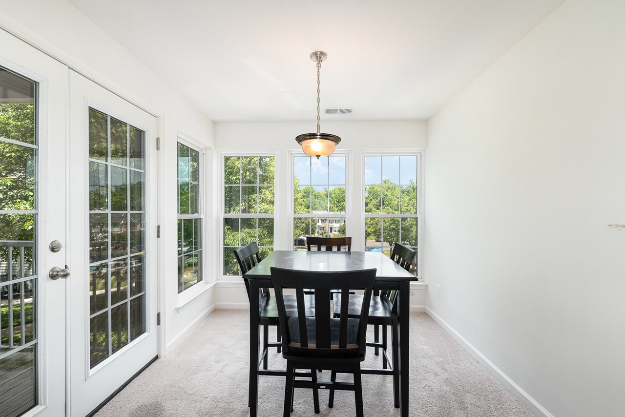 dining area or sunroom with deck access