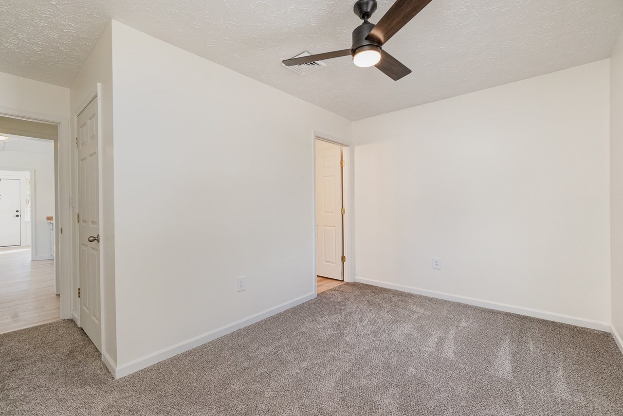 primary bedroom with full bath